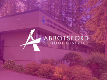 Picture of Abbotsford School Board office with pink overlay and logo in the middle