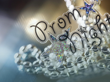 "Prom Night" text in clear confetti style bubble decorations. Sparkly bubbled star and clear beads.