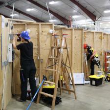 Female student competing in Skills Canada competition for electrical wiring